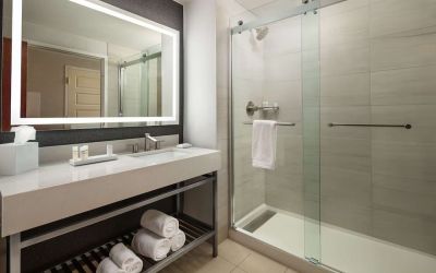 Guest bathroom with shower at Hilton Charlotte Airport.
