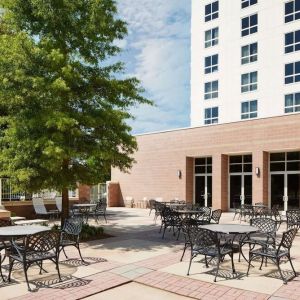 Outdoor seats available in the courtyard of the Hilton Charlotte Airport.
