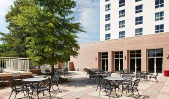 Outdoor seats available in the courtyard of the Hilton Charlotte Airport.
