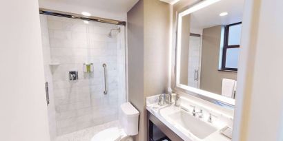Guest bathroom with shower at Hilton Chicago.