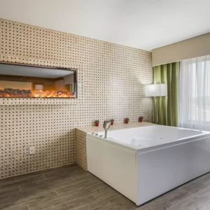 Bath tub inside day use room at The Leo Collection, An Ascend Collection Hotel.