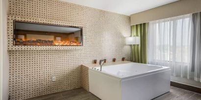 Bath tub inside day use room at The Leo Collection, An Ascend Collection Hotel.