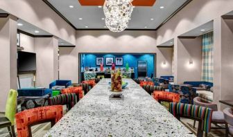 Dining area perfect for coworking at Hampton Inn & Suites By Hilton Atlanta Perimeter Dunwoody.