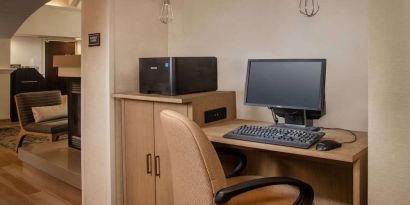 Business center with computer, printer and ergonomic chair at Sonesta ES Suites Baltimore BWI Airport.