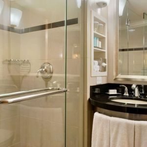 Guest bathroom with shower at New York Hilton Midtown.
