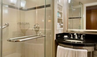 Guest bathroom with shower at New York Hilton Midtown.