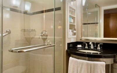 Guest bathroom with shower at New York Hilton Midtown.