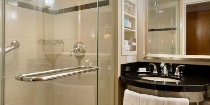 Guest bathroom with shower at New York Hilton Midtown.
