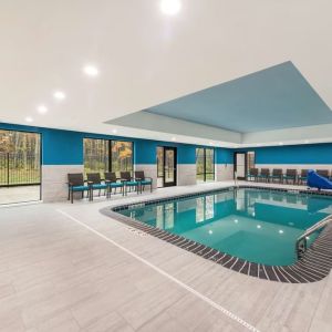 Relaxing indoor heated pool with lounge chairs at Hampton Inn & Suites Benton Harbor.