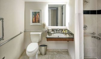 Private guest bathroom with shower and free toiletries at Hilton Minneapolis.