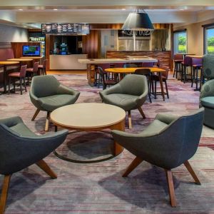 Lobby lounge area and workspace at Sonesta Select Boston Lowell Chelmsford.