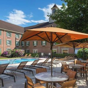 Outdoor pool and lounge area at Sonesta Select Boston Lowell Chelmsford.