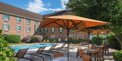 Outdoor pool and lounge area at Sonesta Select Boston Lowell Chelmsford.