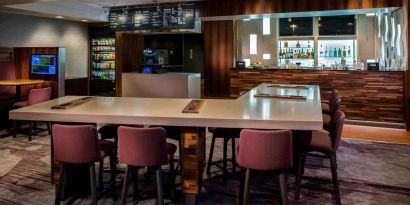 Dining area and workspace, perfect for coworking at Sonesta Select Boston Lowell Chelmsford.