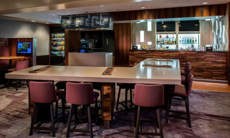 Dining area and workspace, perfect for coworking at Sonesta Select Boston Lowell Chelmsford.