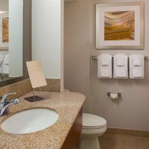 Private guest bathroom with shower and free toiletries at Sonesta Select Boston Lowell Chelmsford.