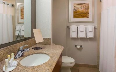 Private guest bathroom with shower and free toiletries at Sonesta Select Boston Lowell Chelmsford.