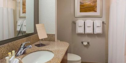Private guest bathroom with shower and free toiletries at Sonesta Select Boston Lowell Chelmsford.
