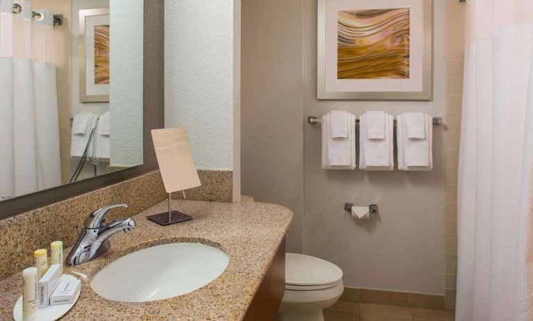 Private guest bathroom with shower and free toiletries at Sonesta Select Boston Lowell Chelmsford.