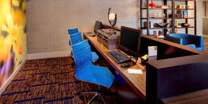 Business center with computers, printer and ergonomic chairs at Sonesta Select Boston Danvers.