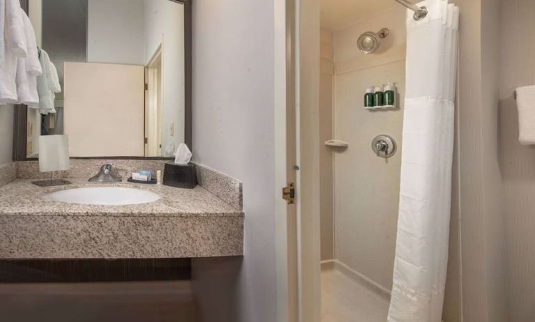 Private guest bathroom with shower and free toiletries at Sonesta Select Allentown Bethlehem Airport.