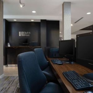 Business center with computers, printer and ergonomic chairs at Sonesta Select Chattanooga Hamilton Place.