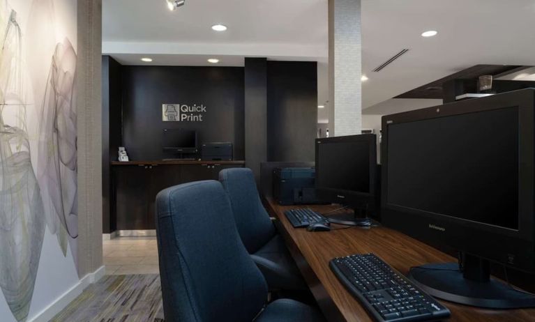Business center with computers, printer and ergonomic chairs at Sonesta Select Chattanooga Hamilton Place.