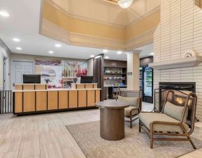 Lobby lounge with fireplace at Sonesta ES Suites Dulles Airport.