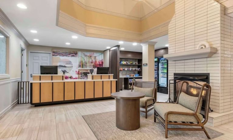 Lobby lounge with fireplace at Sonesta ES Suites Dulles Airport.
