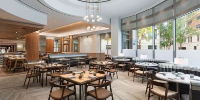 Dining area with natural light perfect for coworking at The Westin Arlington Gateway.