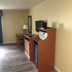 TV and mini-fridge at Quality Inn & Suites Woodstock Near Lake Geneva.