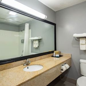 Guest bathroom at Quality Inn & Suites Woodstock Near Lake Geneva.