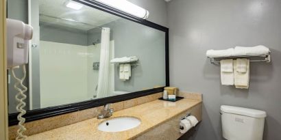 Guest bathroom at Quality Inn & Suites Woodstock Near Lake Geneva.