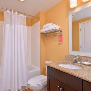 Guest bathroom with shower at Towneplace Suites By Marriott Arundel Mills.