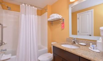 Guest bathroom with shower at Towneplace Suites By Marriott Arundel Mills.