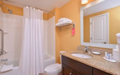Guest bathroom with shower at Towneplace Suites By Marriott Arundel Mills.