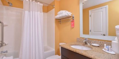 Guest bathroom with shower at Towneplace Suites By Marriott Arundel Mills.