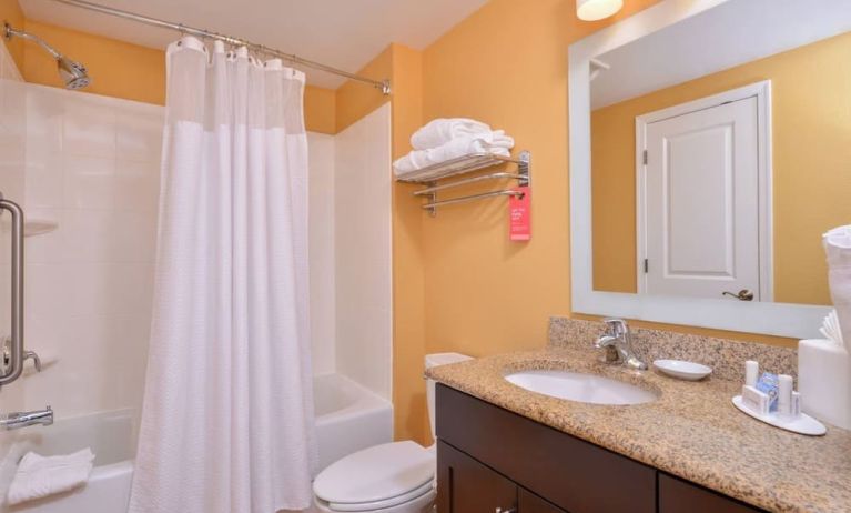 Guest bathroom with shower at Towneplace Suites By Marriott Arundel Mills.