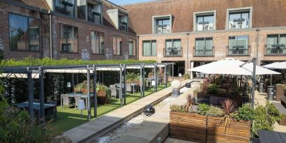 Hotel terrace and garden at Hilton London Syon Park.