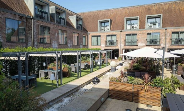 Hotel terrace and garden at Hilton London Syon Park.
