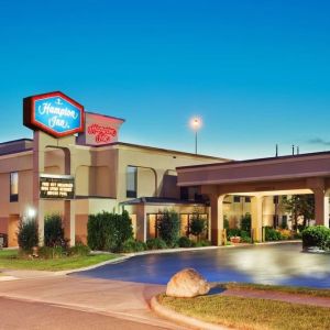 Hotel entrance and parking area at Hampton Inn Columbus-East. 