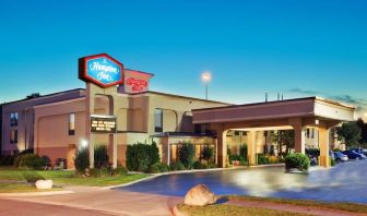 Hotel entrance and parking area at Hampton Inn Columbus-East. 