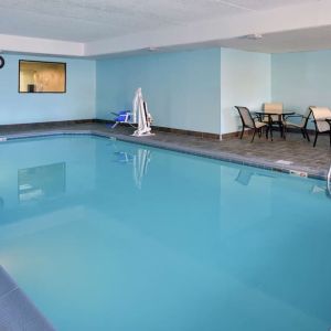 Indoor heated pool with lounge chairs at Hampton Inn Columbus-East.