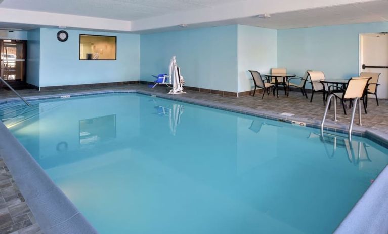 Indoor heated pool with lounge chairs at Hampton Inn Columbus-East.