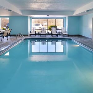 Relaxing indoor pool with lounge seating at Hampton Inn Columbus-East.