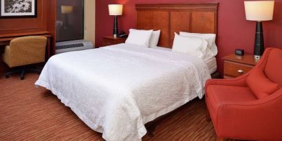 Day use room with work desk and sofa at Hampton Inn Columbus-East.