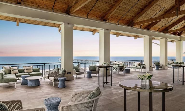 Lounge area at Embassy Suites By Hilton Panama City Beach Resort's terrace.