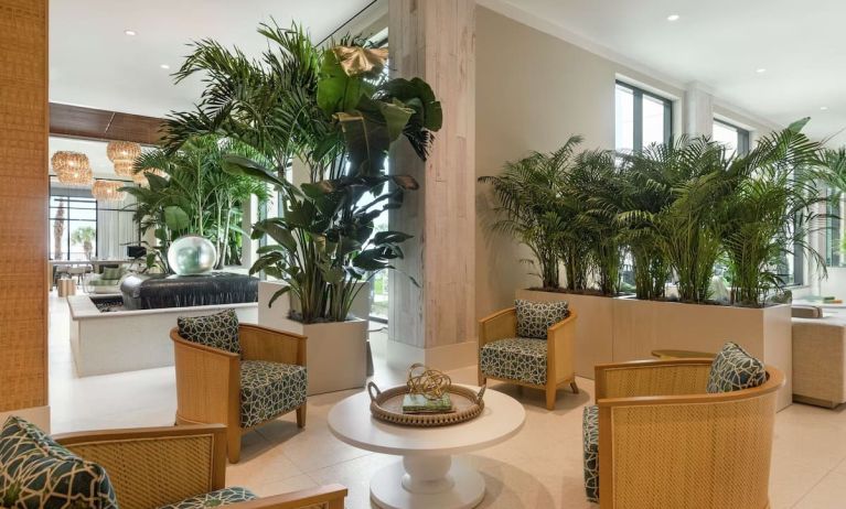 Comfortable lobby lounge area and workspace at Embassy Suites By Hilton Panama City Beach Resort.