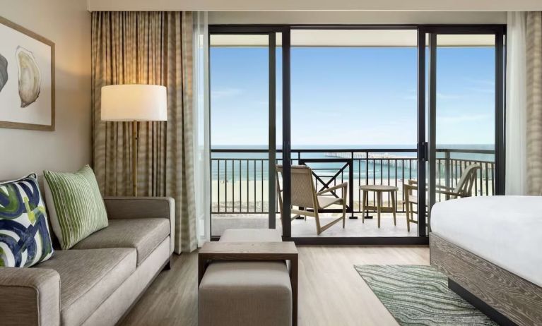 Day use suite with balcony and lounge area at Embassy Suites By Hilton Panama City Beach Resort.