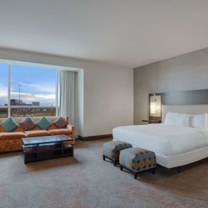 Spacious meeting room with living area at Hilton Dallas/ Plano Granite Park.
